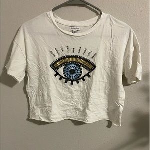 it’s a cropped evil eye shirt with gems